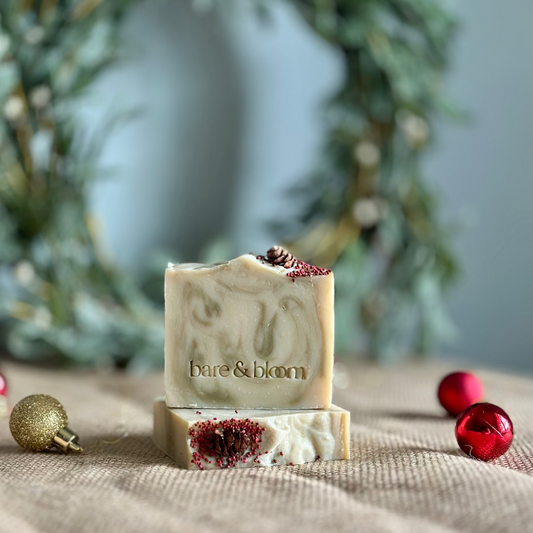 Bar of soap with visible brand name on a textured surface with decorative elements