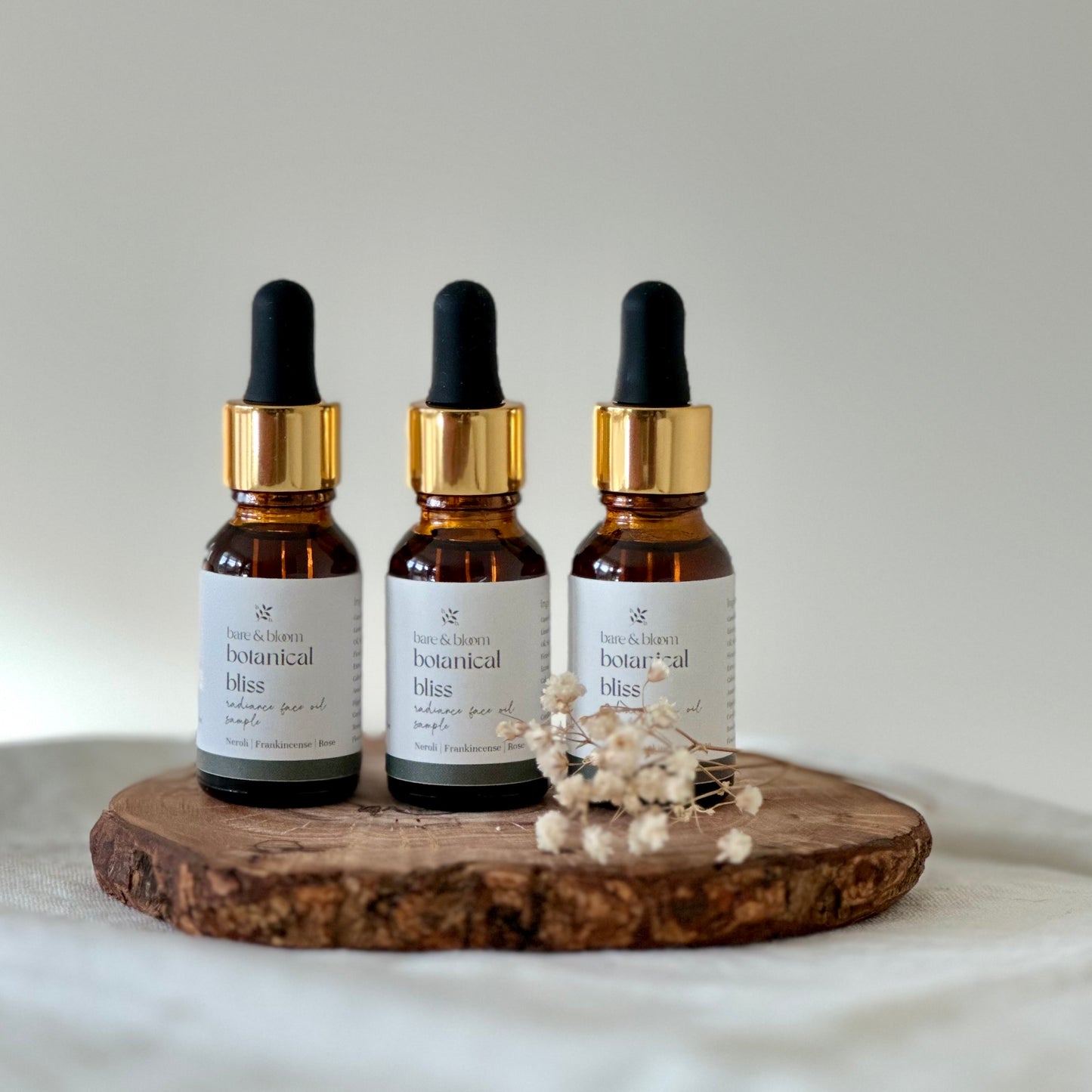 3 small face oils in amber jars