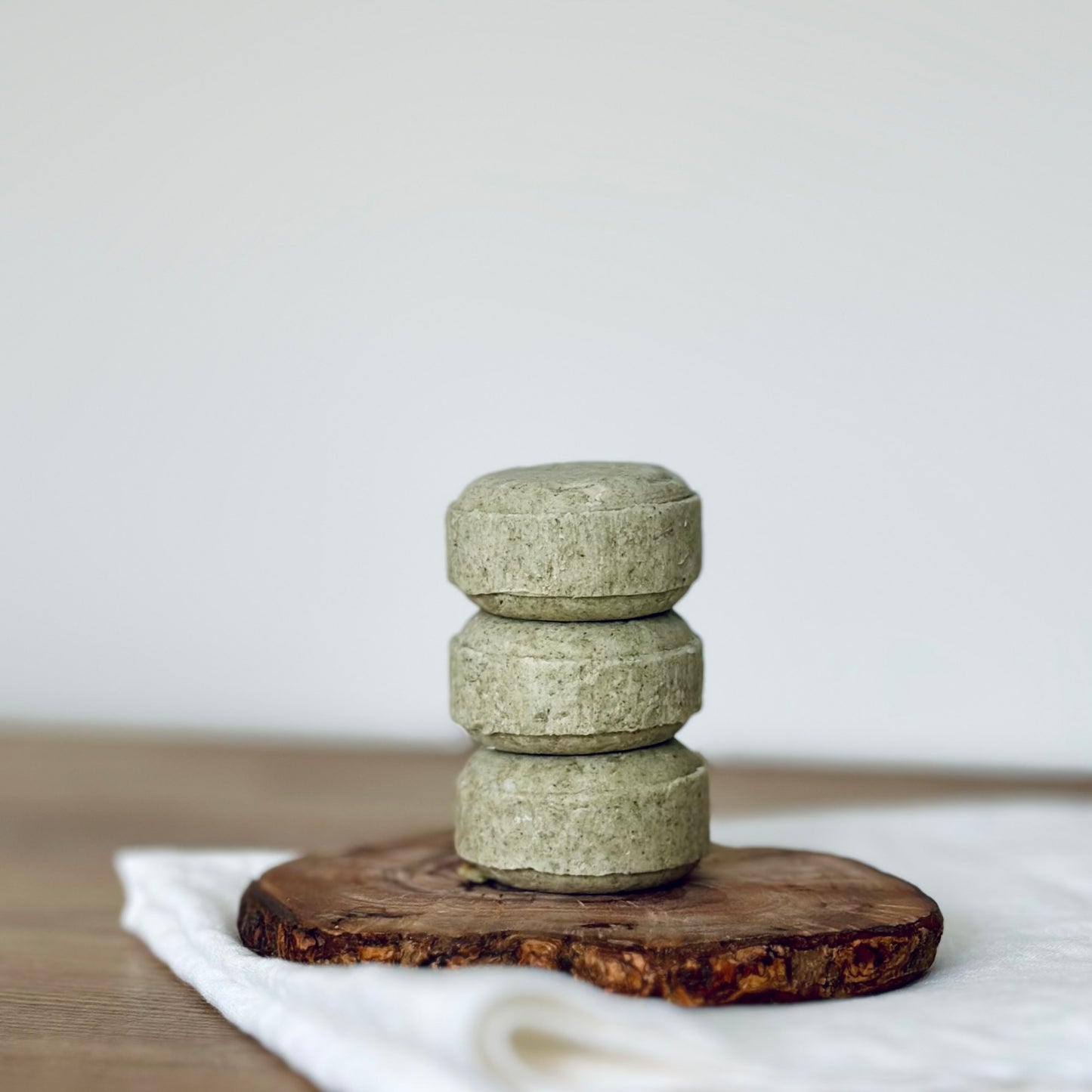 stack of 3 green solid shampoo bars