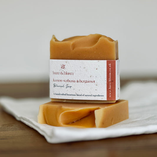 2 natural artisan soaps on top of a white linen sheet