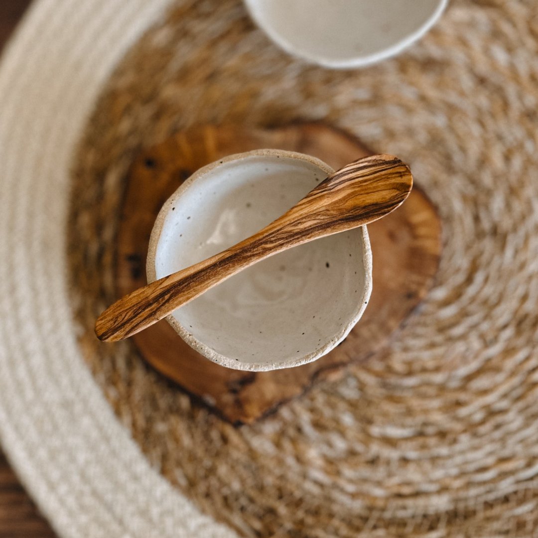 handmade ceramic mask bowl and olive wood spoon